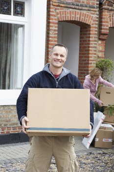 Moving van and packed boxes for a Harrow home move