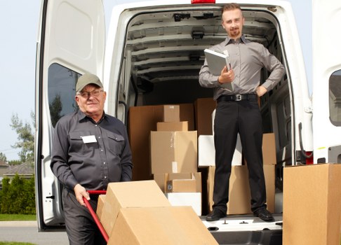 Removal van and packed boxes prepared for a Harrow home move