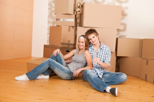 Flat removal team handling apartment furniture in Harrow