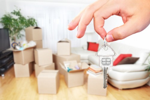 Removal team handling household belongings during a booked move