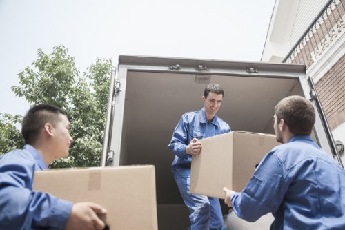 Careful loading of student belongings for removals in Harrow