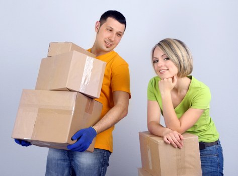 A local moving team organising belongings in a Harrow property