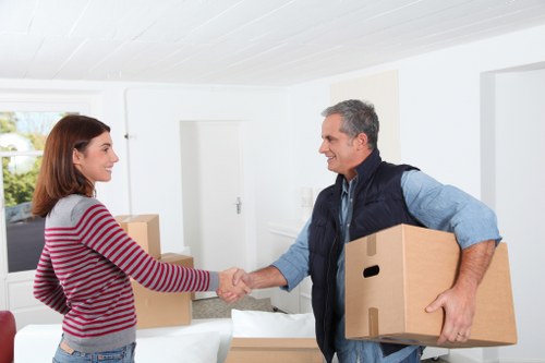 Prepared moving boxes and furniture for a Harrow removal van