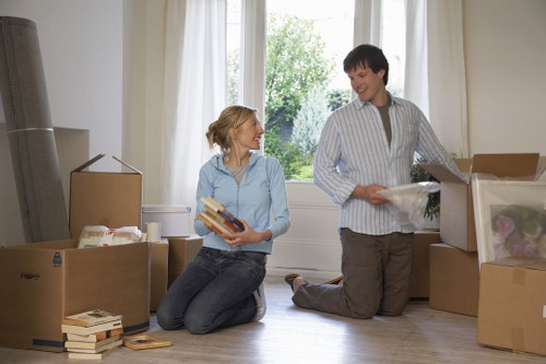 Packed moving boxes and household items ready for transport in Harrow