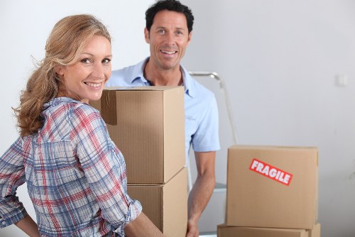 Professional movers handling desks and furniture during a Harrow office move
