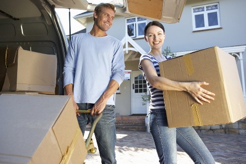 Professional removals crew loading furniture for transport in Harrow